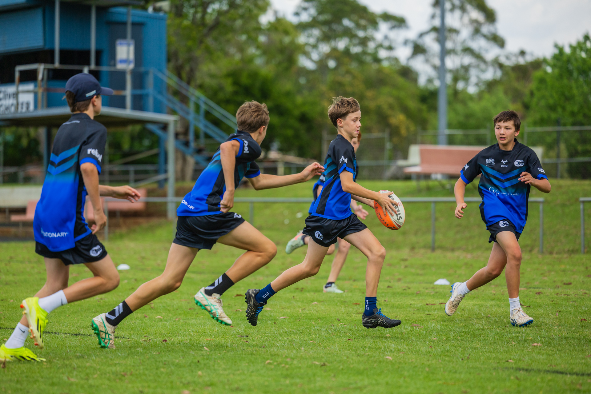 Boys running rugby league drill