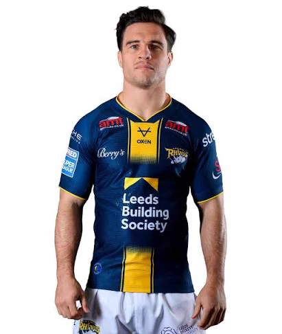 Brodie Croft in a navy and yellow Leeds Rhinos jersey with Leeds Building Society sponsor