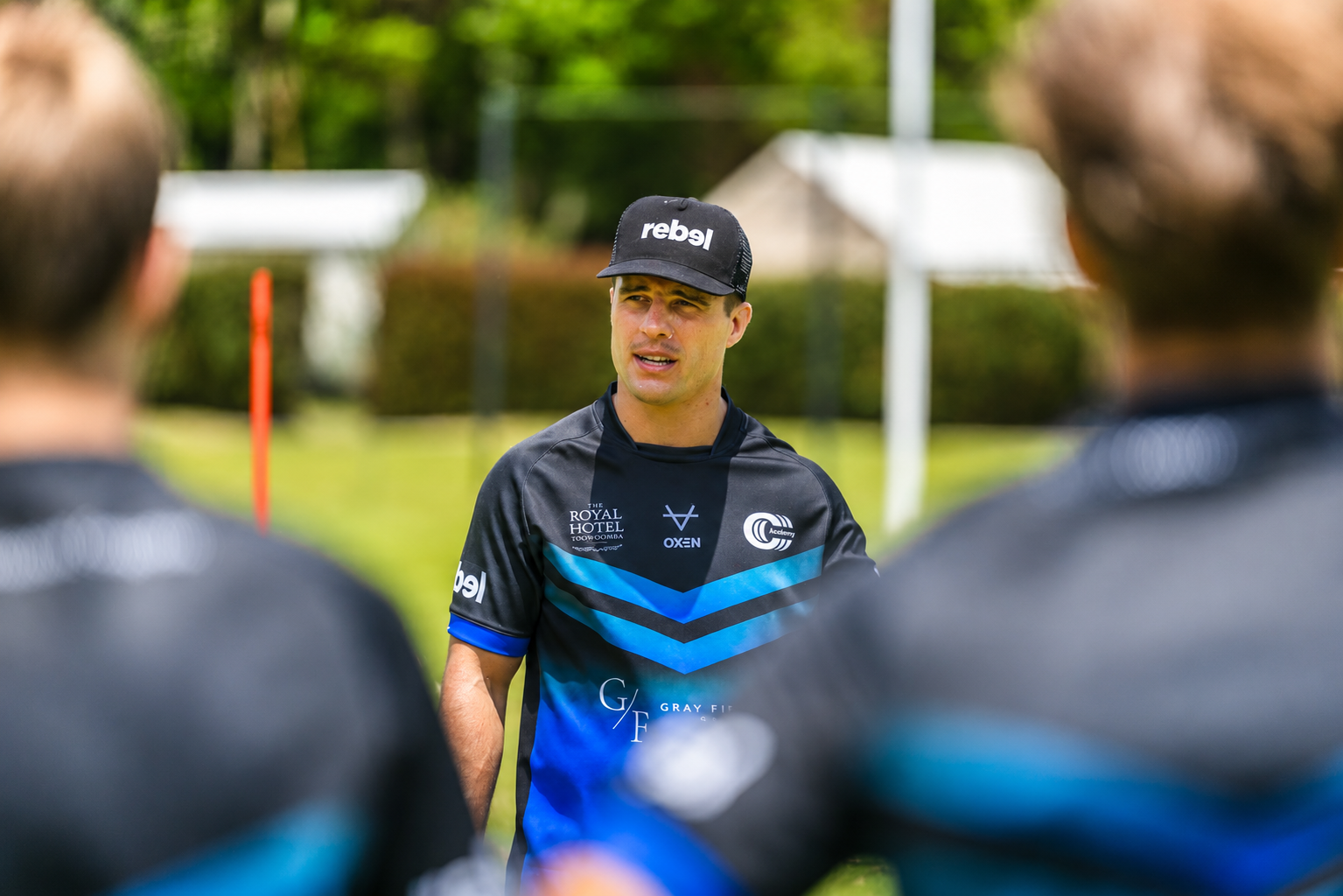 Brodie Croft mid-instruction, speaking to junior players during a Triple C Academy training session